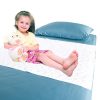 Waterproof bedding overlay with girl sitting on bed